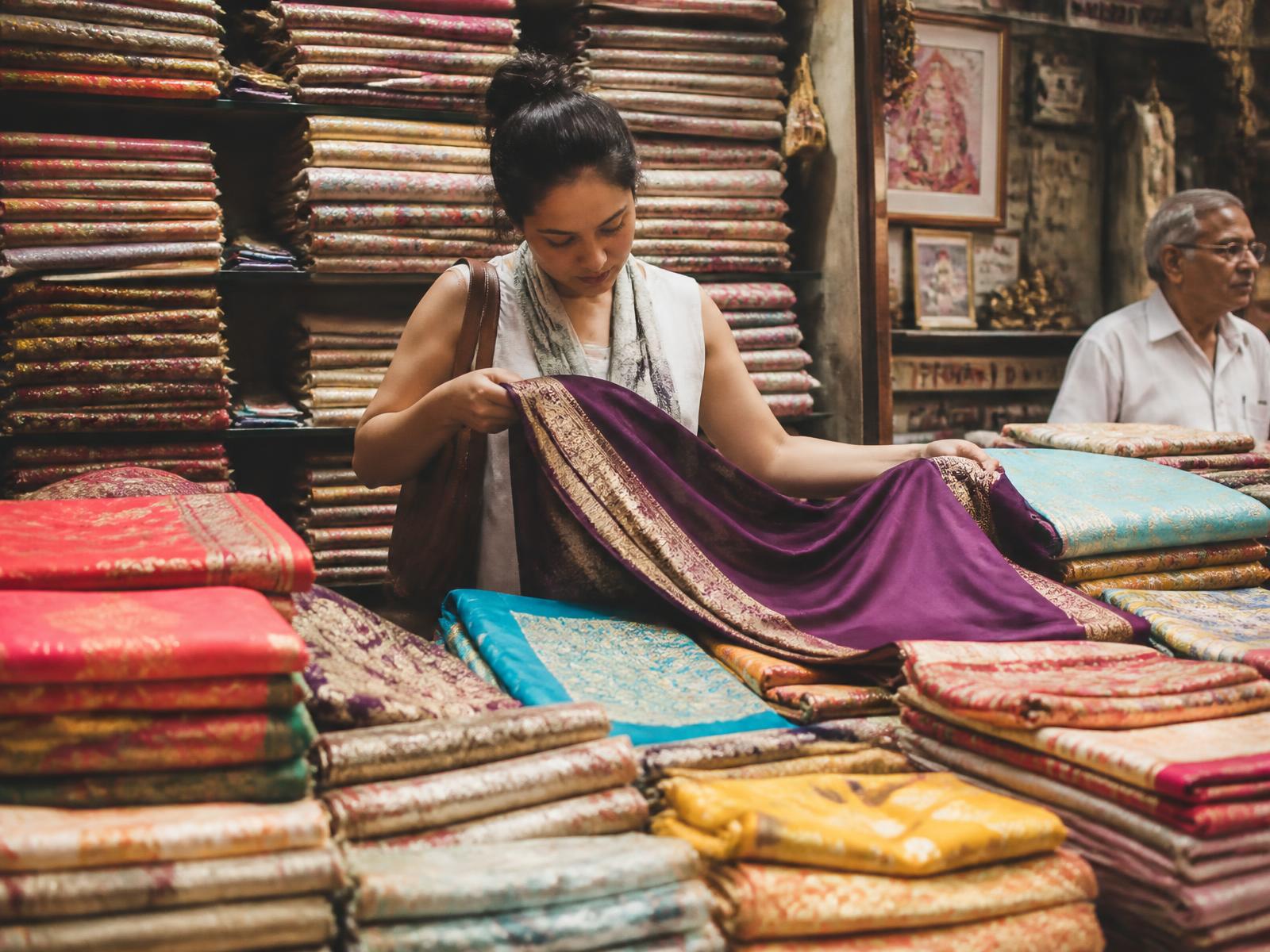 Stacks of vintage sarees in an Indian textile market