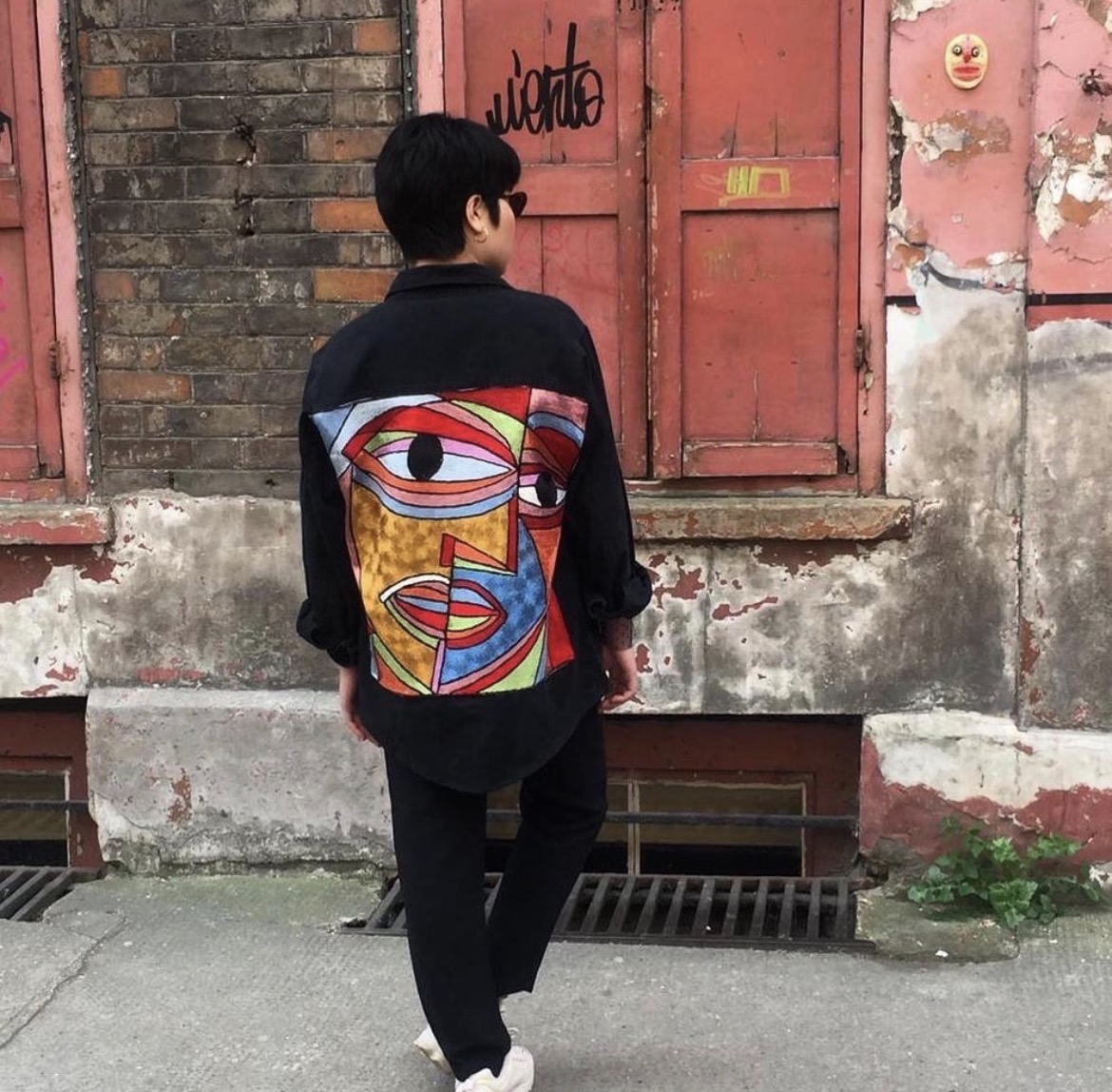 Cubist Face — Street — Black-shouldered denim trucker with a full-back cubist portrait.